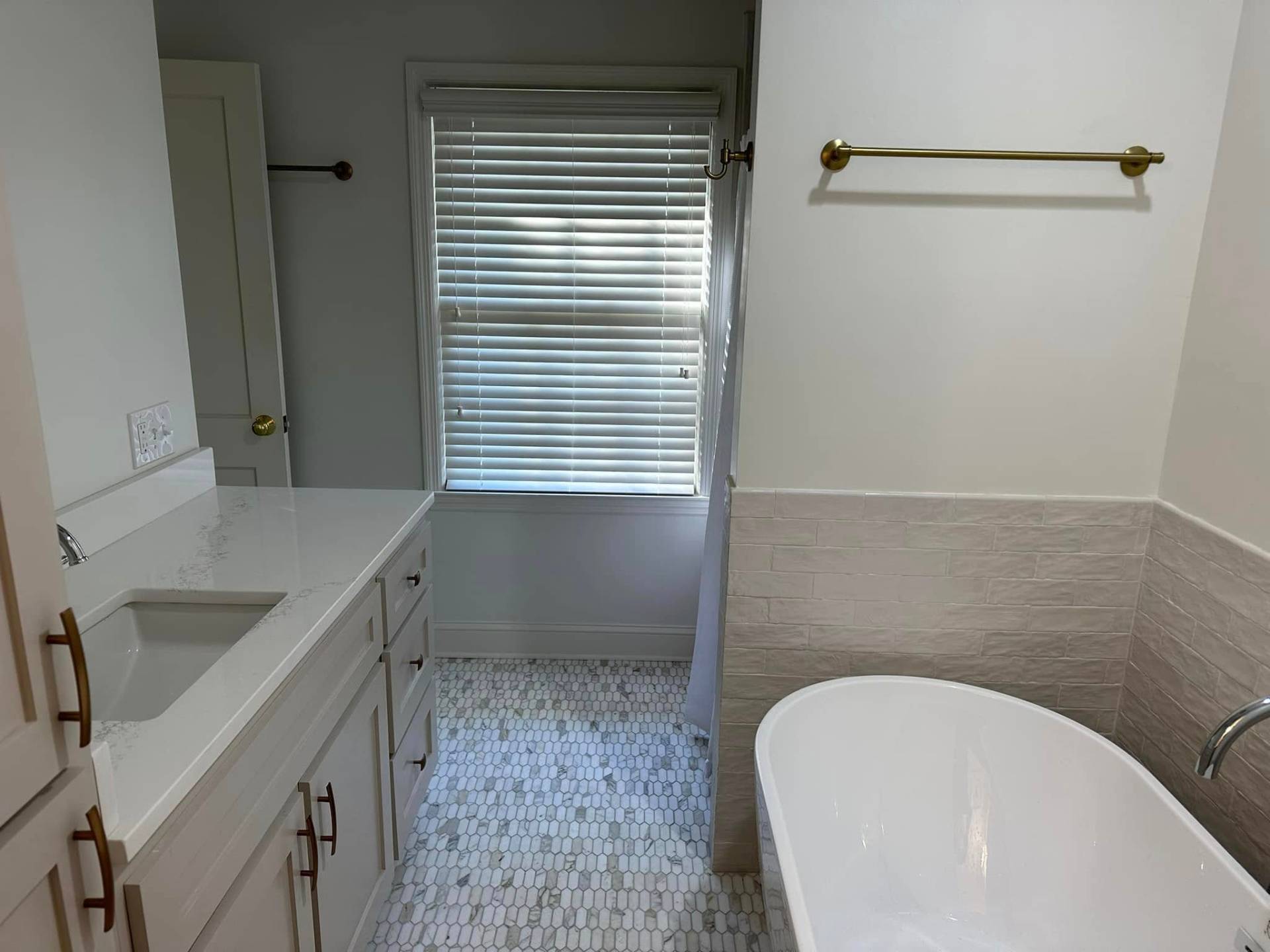 Bathroom after - freestanding tub with marble floor