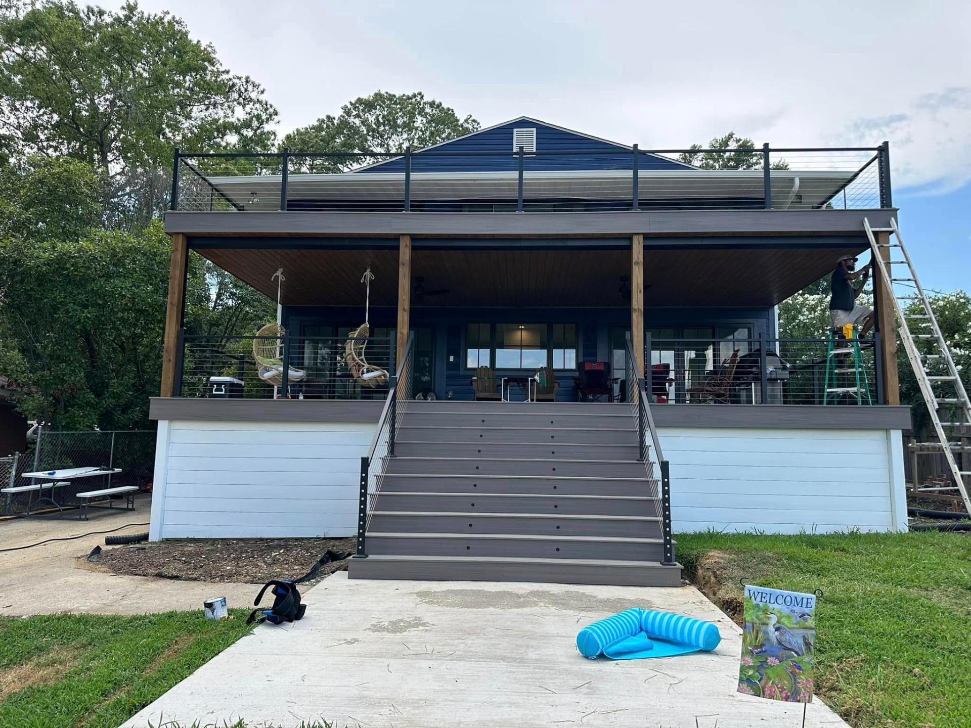 Deck after restoration - modern composite with cable railings